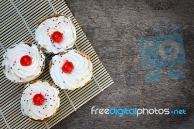 Deliciou Cupcake On The Wooden Floor Stock Photo