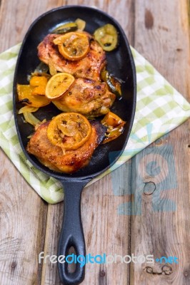 Delicious Baked Chicken Thighs With Lemon Slices, Onion And Zucchini Stock Photo