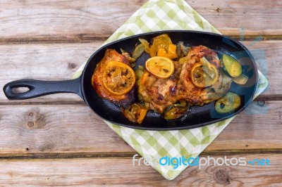 Delicious Baked Chicken Thighs With Lemon Slices, Onion And Zucchini Stock Photo