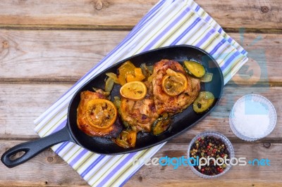 Delicious Baked Chicken Thighs With Lemon Slices, Onion And Zucchini Stock Photo