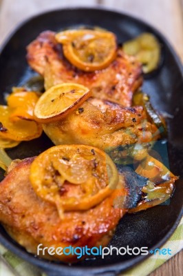 Delicious Baked Chicken Thighs With Lemon Slices, Onion And Zucchini Stock Photo