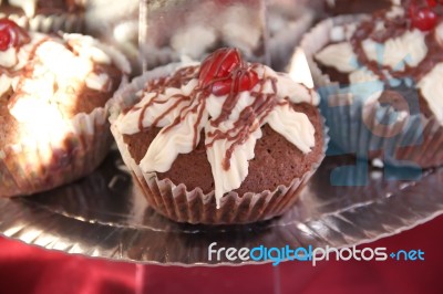 Delicious Cupcakes And Muffins With Chocolate And Cherries Stock Photo