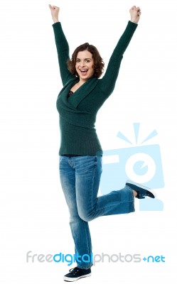 Delighted Young Woman Dancing With Joy Stock Photo