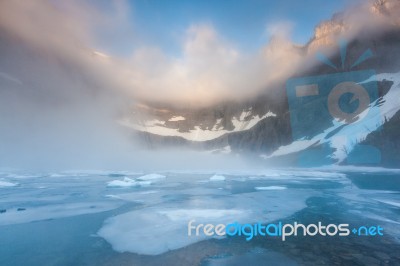 Dent Fog Over Iceberg Lake, Glacier National Park Stock Photo