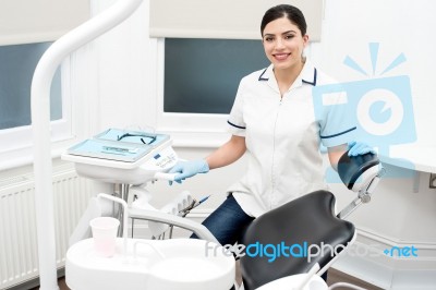 Dental Assitant Smiling At Camera Stock Photo