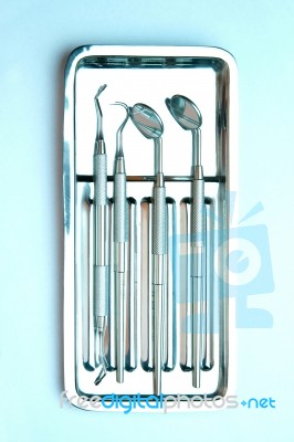 Dental Tools On Plate Stock Photo