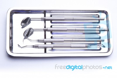 Dental Tools On Plate Stock Photo