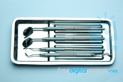 Dental Tools On Plate Stock Photo