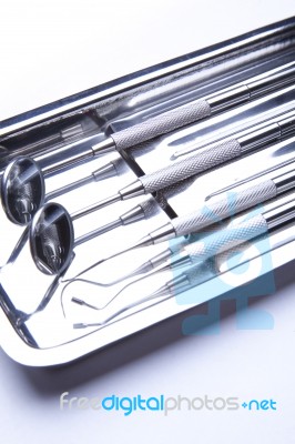 Dental Tools On Plate Stock Photo