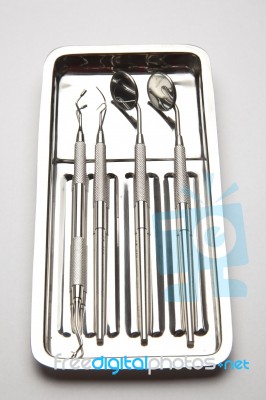 Dental Tools On Plate Stock Photo