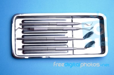 Dental Tools On Plate Stock Photo