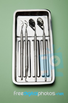 Dental Tools On Plate Stock Photo