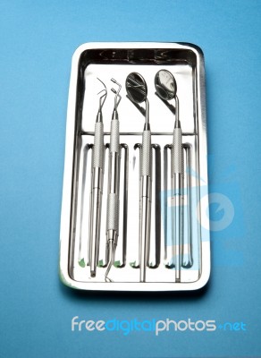 Dental Tools On Plate Stock Photo