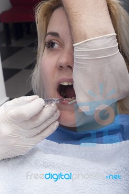 Dentist Anesthetizing Patient Stock Photo