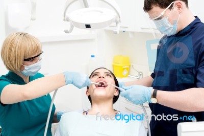 Dentist Cleaning A Woman Teeth Stock Photo