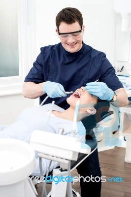 Dentist Examine On A Female Patient Stock Photo