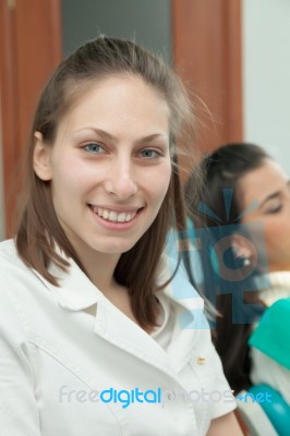 Dentist Examining A Patient's Teeth In The Dentist Stock Photo