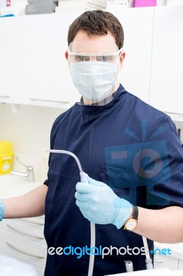 Dentist Holding Dental Tools Stock Photo