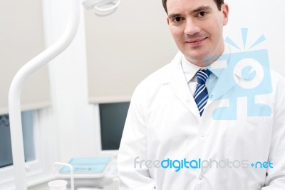 Dentist In His Modern Clinic Stock Photo