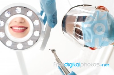 Dentist Preparing Dental Mirror For Working Stock Photo