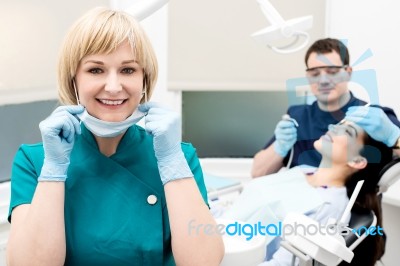 Dentist Treating His Patient Stock Photo