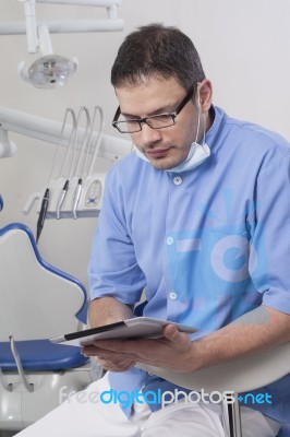 Dentists Using Digital Tablet Stock Photo