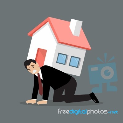 Desperate Businessman Carry A Heavy Home Stock Image