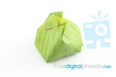 Dessert Banana Leaf Package With Bamboo Stick Stock Photo