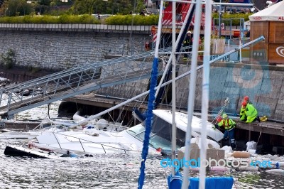 Destroyed  By Thunderstorm Piers With Boats In Verbania, Italy Stock Photo