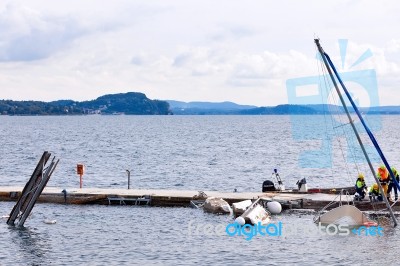 Destroyed  By Thunderstorm Piers With Boats In Verbania, Italy Stock Photo