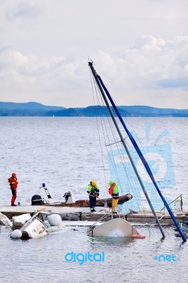 Destroyed  By Thunderstorm Piers With Boats In Verbania, Italy Stock Photo