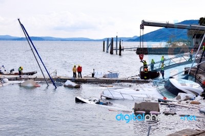 Destroyed  By Thunderstorm Piers With Boats In Verbania, Italy Stock Photo