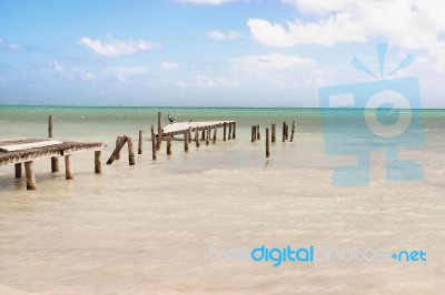 Destroyed Wooden Pier Dock And Picturesque, Relaxing Ocean View Stock Photo