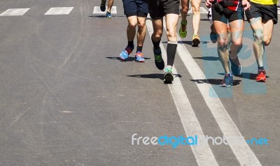 Detail Of A Group Of Runners During A City Marathon Stock Photo