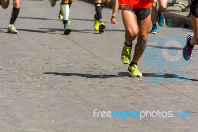 Detail Of A Group Of Runners During A City Marathon Stock Photo