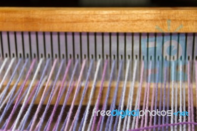 Detail Of Fabric In Comb Loom With Ultraviolet And Lilac Colors Stock Photo