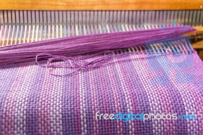 Detail Of Fabric In Comb Loom With Ultraviolet And Lilac Colors Stock Photo