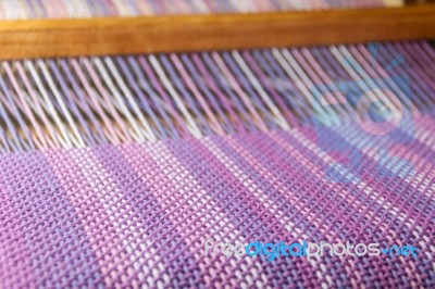 Detail Of Fabric In Comb Loom With Ultraviolet And Lilac Colors Stock Photo