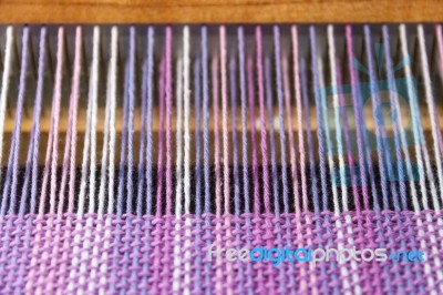 Detail Of Fabric In Comb Loom With Ultraviolet And Lilac Colors Stock Photo