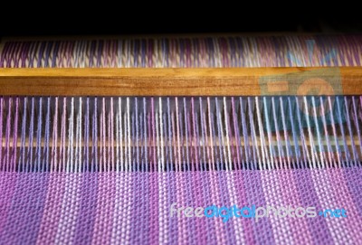 Detail Of Fabric In Comb Loom With Ultraviolet And Lilac Colors Stock Photo