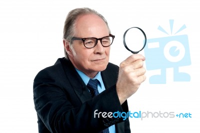 Detective  Exploring Through A Magnifying Glass Stock Photo