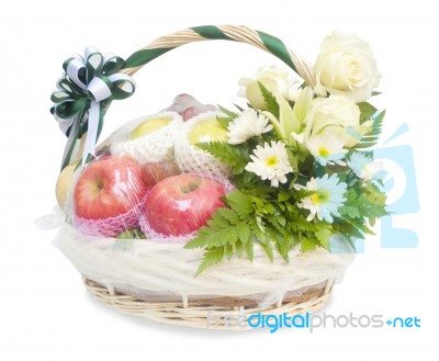 Different Fruits And Flowers In Wicker Basket Stock Photo