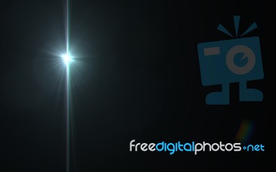 Digital Lens Flare In Black Background.beautiful Rays Of Light Stock Image