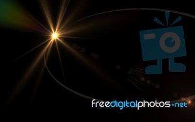 Digital Lens Flare In Black Background.beautiful Rays Of Light Stock Image