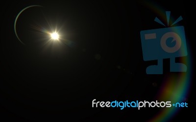 Digital Lens Flare In Black Background.beautiful Rays Of Light Stock Image