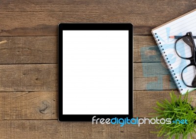 Digital Tablet On Wood Table Blank Space For Adjustment Stock Photo