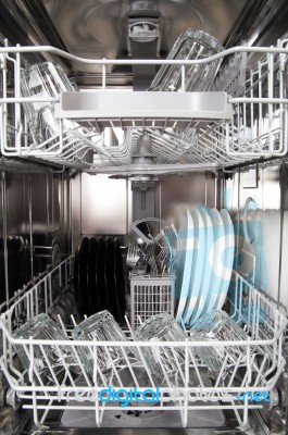 Dishes In A Modern Dishwasher Machine Stock Photo