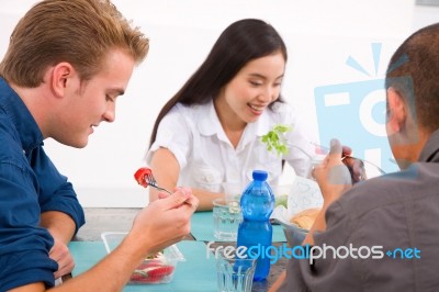 Diverse Group Of Friends Eating Food Stock Photo