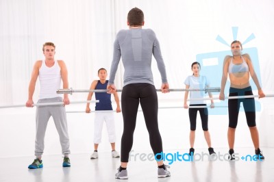 Diverse Group Of People Exercising In Gym Stock Photo