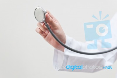 Doctor Holding Stethoscope Stock Photo